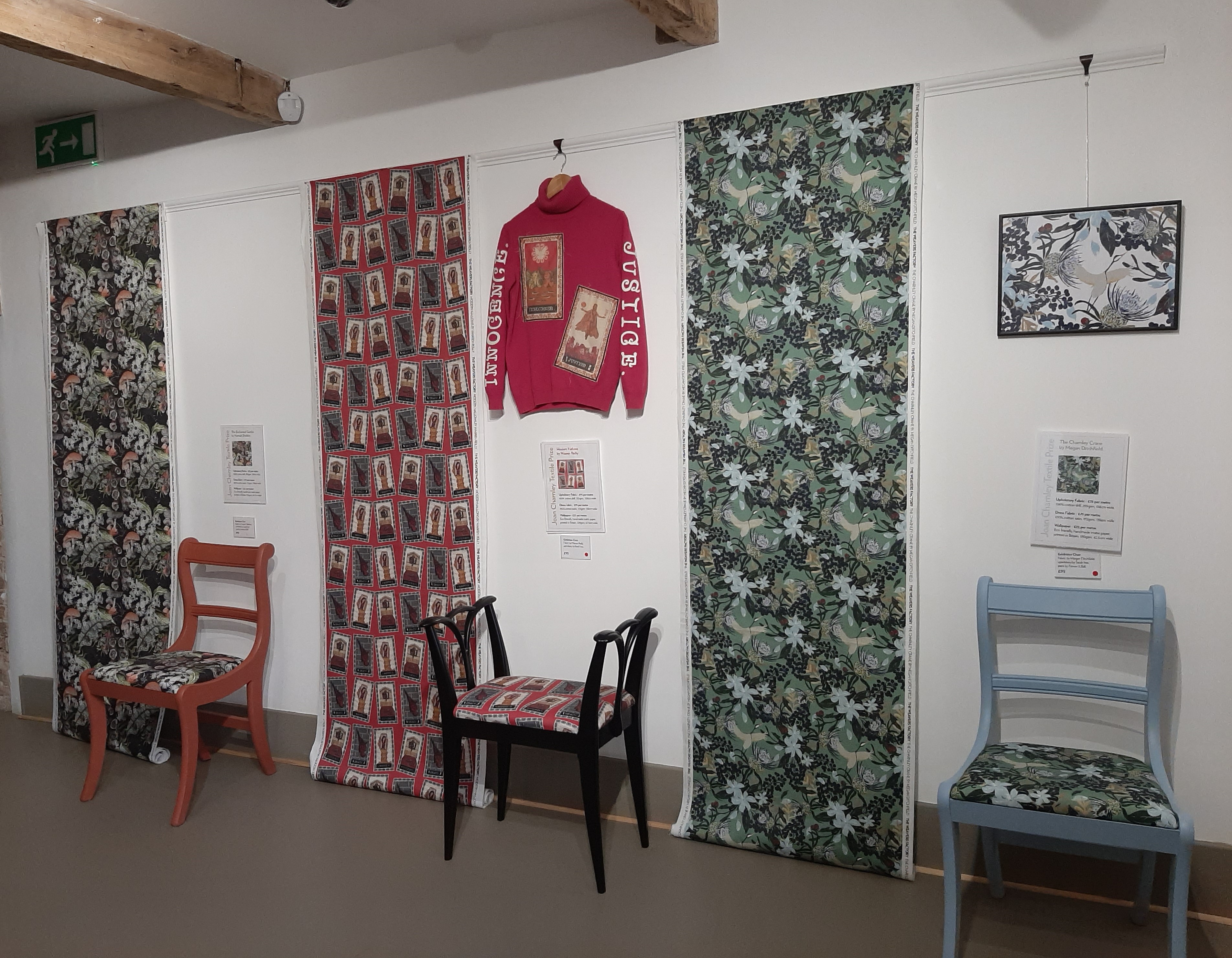 Image showing the three winning design on display in an exhibiiton at the Weavers Factory