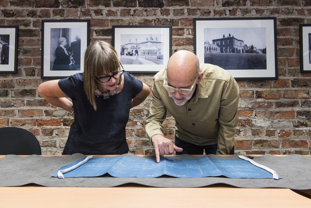 The artists surveying plans in Preston Park Museum