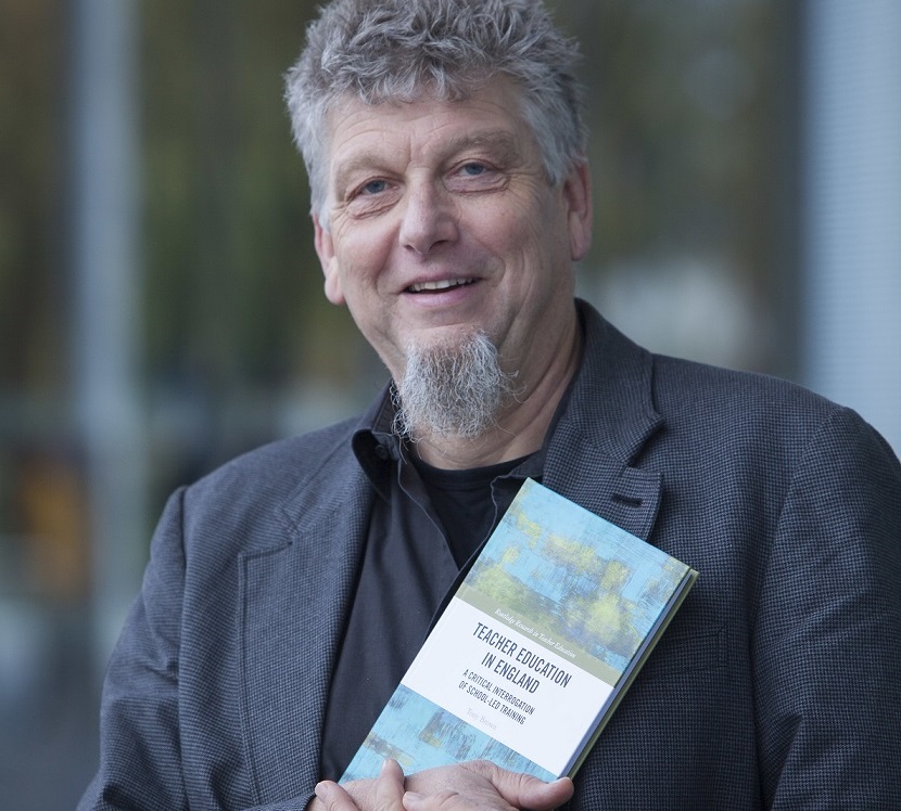 Professor Tony Brown with his new book