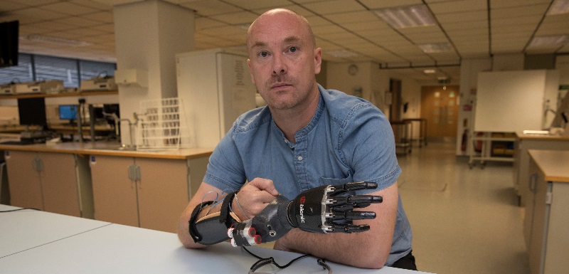 Dr Greg Wood, Senior Lecturer in Motor Control and Learning, demonstrates the prosthetic hand simulator built especially for the research