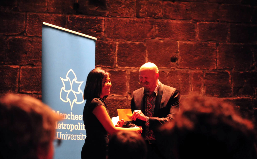 Romalyn receiving the Manchester Poetry Prize in 2017