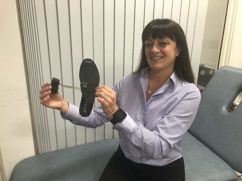 Dr Abbott displays the intelligent insole system she and colleagues tested for the first clinical trial of the technology