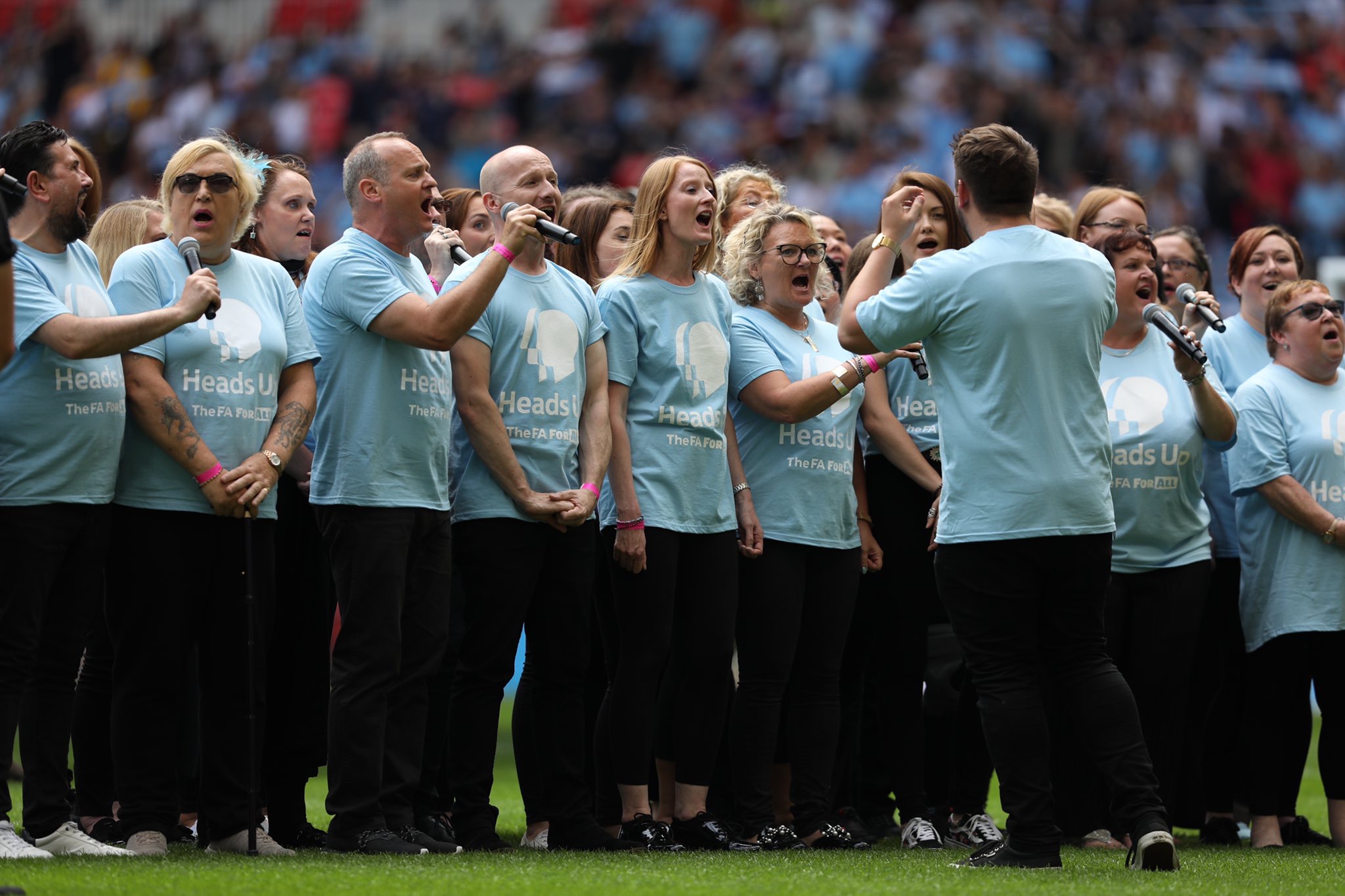 The Bee Vocal Choir, run by Manchester Metropolitan Research Assistant Elaine Craig, seen here performing at Wembley stadium