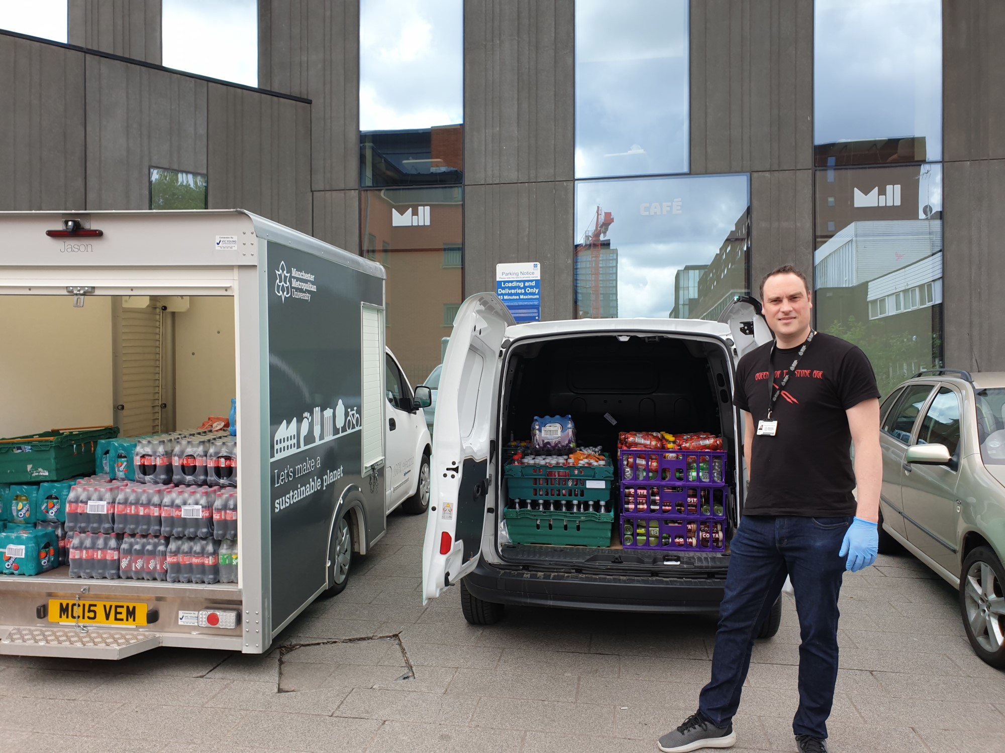 Ben Collier, Head of Catering at Manchester Metropolitan, loads the donations into a van