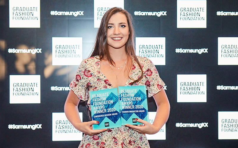 Image showing Sophie Parnaby with awards for the Considered Fashion Award and Fashion Innovation Award