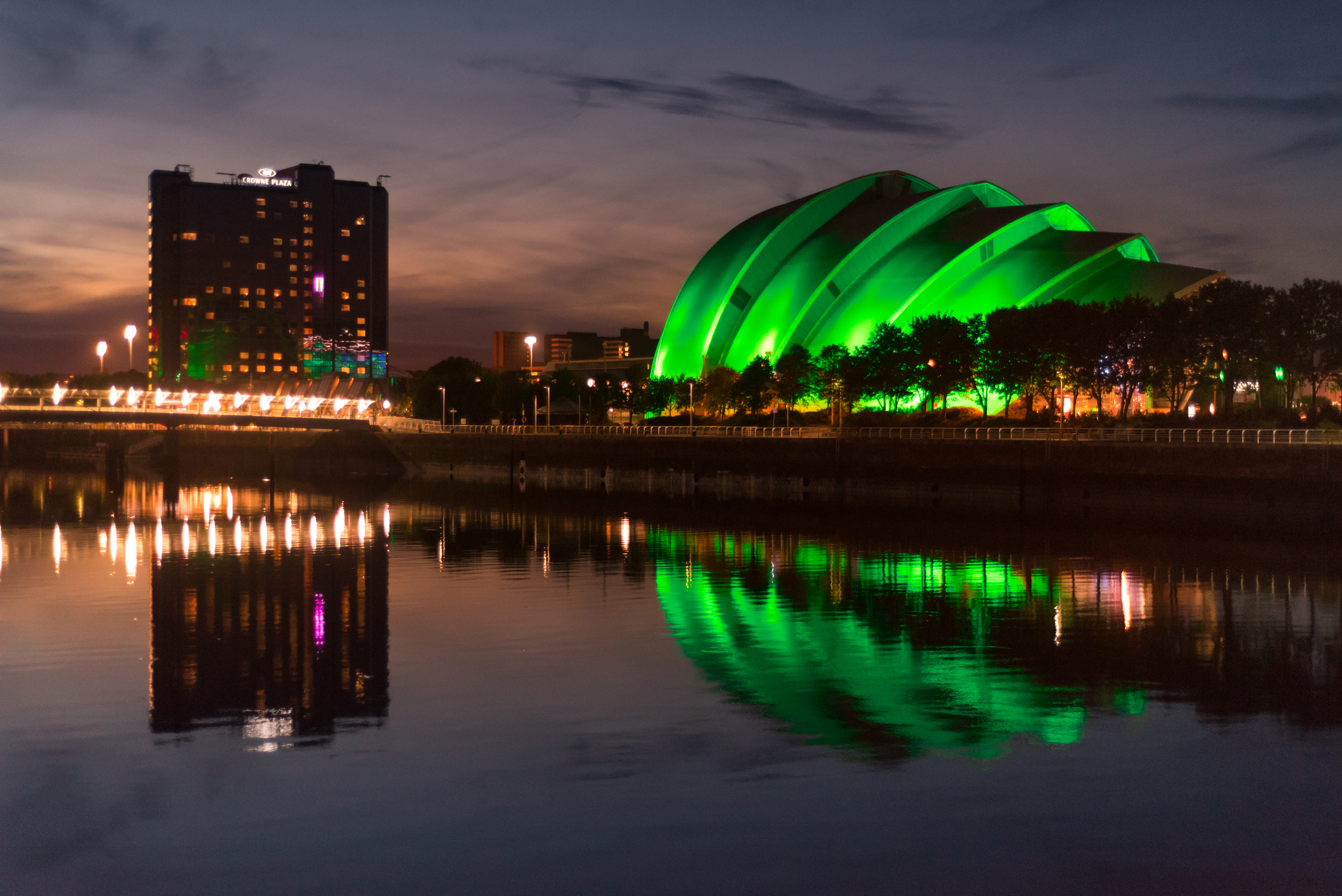 The Scottish Event Campus in Glasgow, illuminated by green lights at night