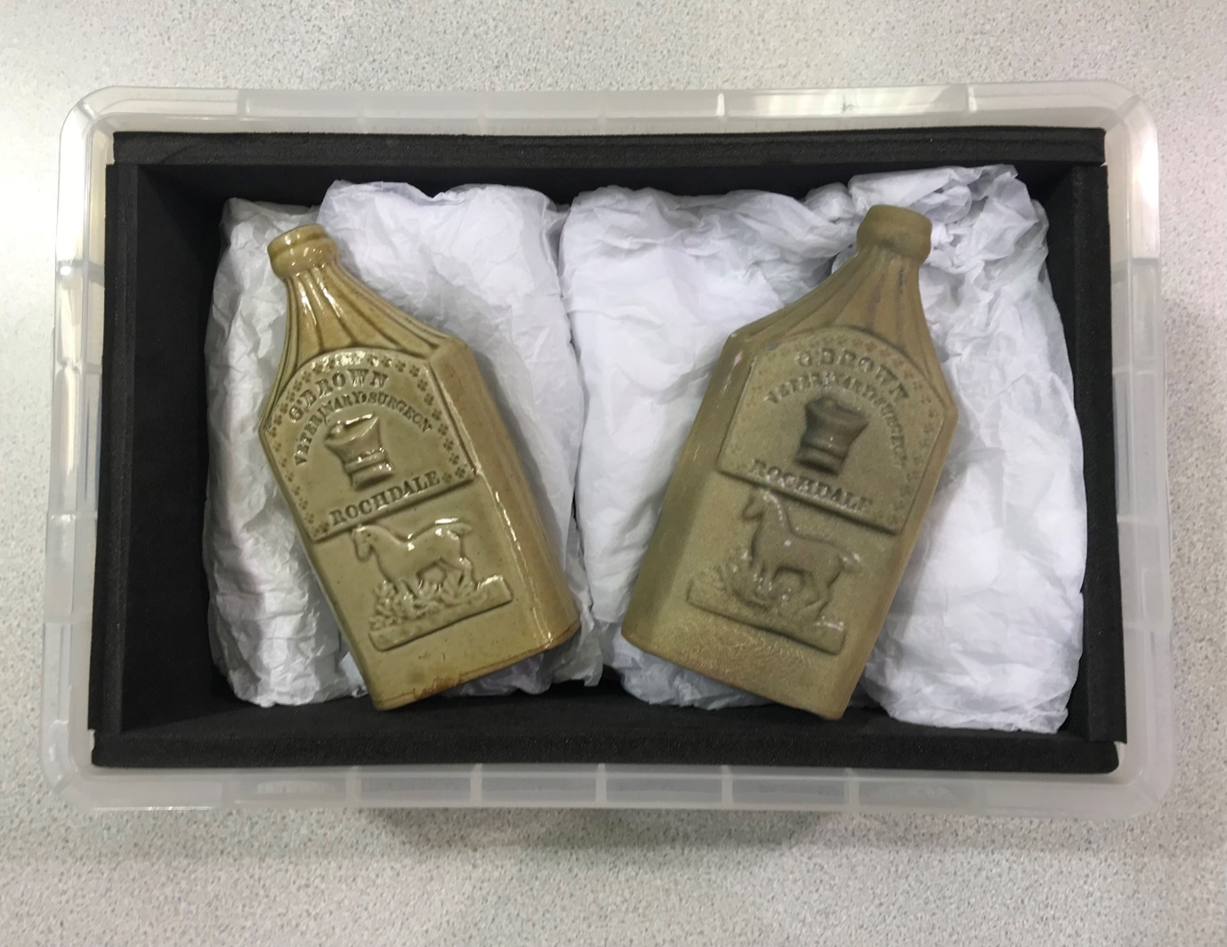 A Stoneware medicine bottle, used by a Veterinary Surgeon in Rochdale, dating from 1850-1860 (left) and the 3D printed version (right)