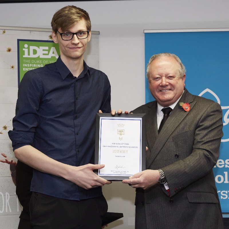 Student Daniel Wardak receives his bronze certificate