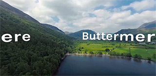 Landscape photo of Buttermere including green hills and a lake